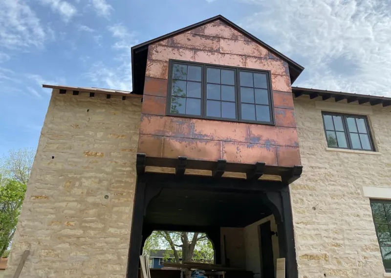 Copper metal panel facade on a stone building for Skylight Installation in East Whittier